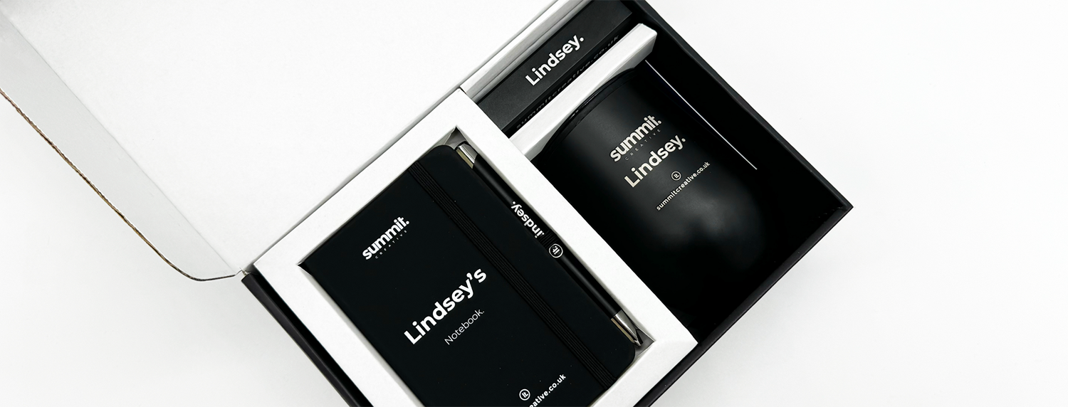 personalised notebook, mug, pen and charger in a direct mail box
