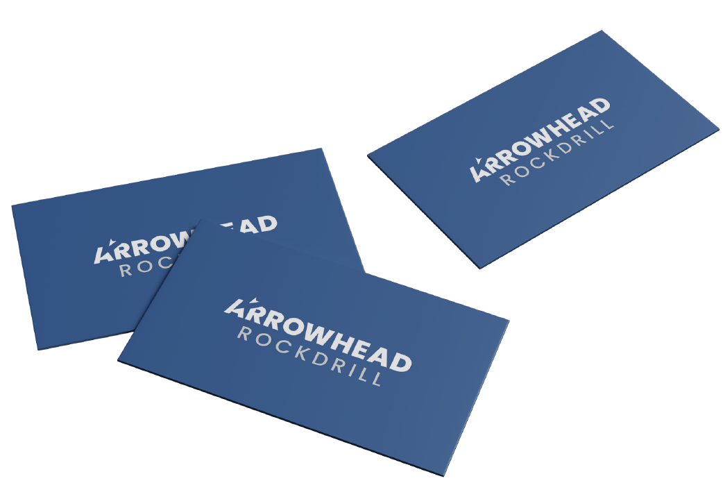 three blue business cards featuring a logo that reads Arrowhead Rockdrill