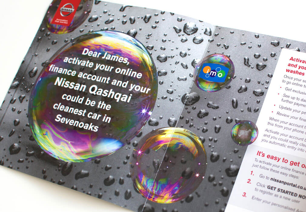 direct mail piece by nissan with a picture of iridescent bubbles on a car with text inside the bubble that reads James activate your online finance account and your nissan qashqai could be the cleanest car in sevenoaks