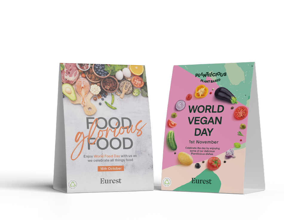 strut cards featuring a eurest logo and images of various food types and copy for world food day and world vegan day