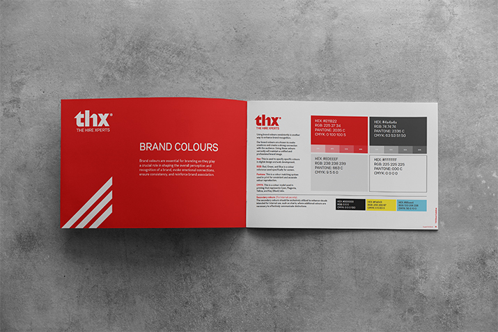 a booklet open with a page that says brand colours and the other page has colour swatches on with colour codes for cmyk and hex